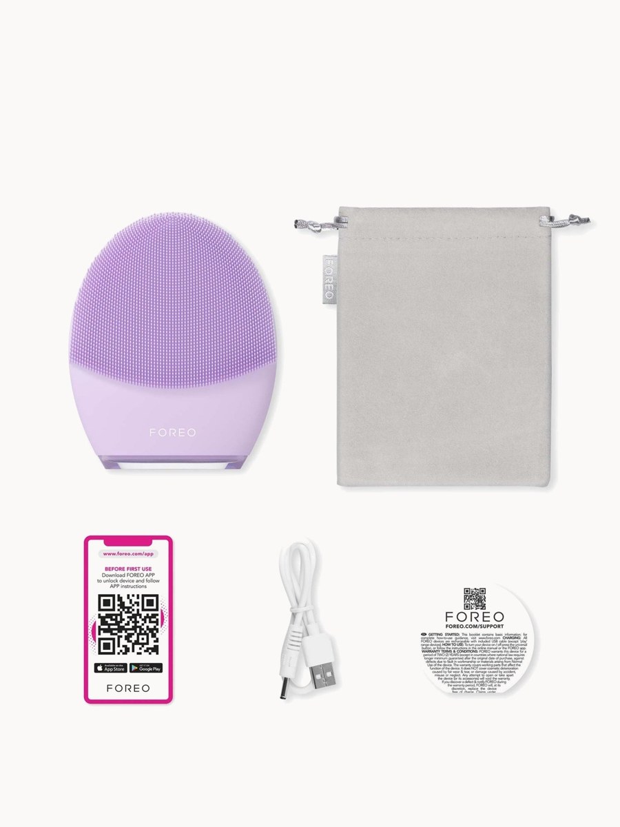 FOREO LUNA 4 for sensitive skin in lavender, with its travel pouch, app activation card, USB cable and warranty card