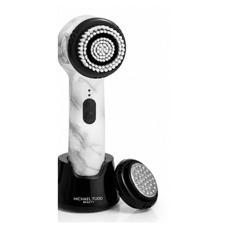 Michael Todd Beauty Soniclear in White Marble on its black charging stand, with its serum infusion head beside it